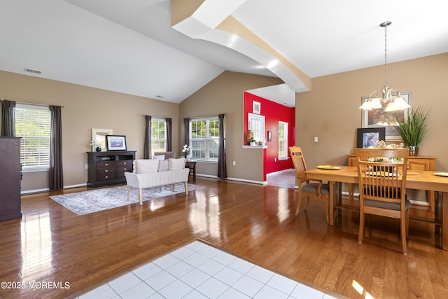 8 Chaminox Ct, Manchester, NJ 08759 - living room with a chandelier, wood finished floors, vaulted ceiling, and baseboards