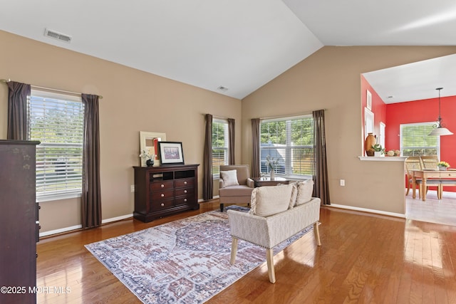 8 Chaminox Ct, Manchester, NJ 08759 - living area with wood finished floors, baseboards, and high vaulted ceiling