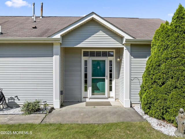 8 Chaminox Ct, Manchester, NJ 08759 - doorway to property with a shingled roof