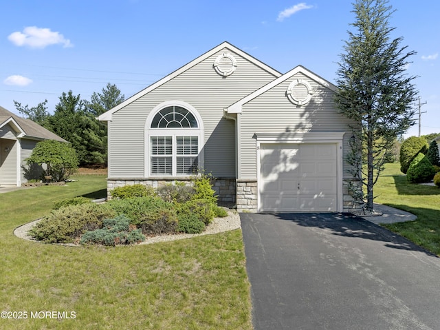 8 Chaminox Ct, Manchester, NJ 08759 - view of front of home featuring driveway, stone siding, a front lawn, and an attached garage