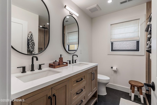 405 Ludlow Ave, Spring Lake, NJ 07762 - bathroom with double vanity, toilet, baseboards, recessed lighting, and tile patterned floors