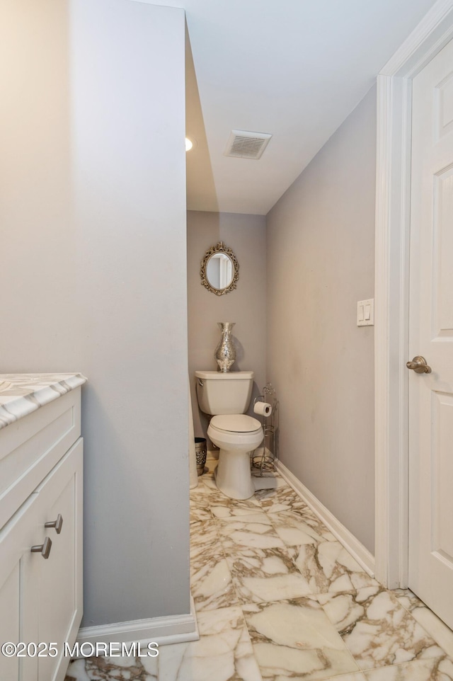 63 Wintergreen Dr, Manalapan, NJ 07726 - bathroom featuring marble finish floors, baseboards, vanity, and toilet