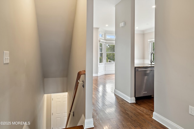 401 Captains Way, Neptune Township, NJ 07753 - hallway with an upstairs landing, dark wood-type flooring, and ornamental molding