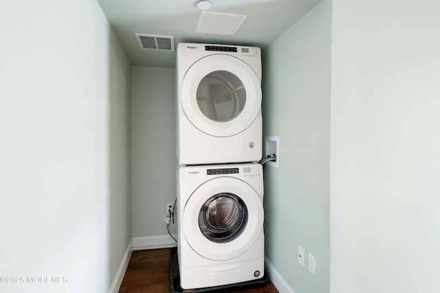 401 Captains Way, Neptune Township, NJ 07753 - washroom with stacked washer / drying machine and dark wood-type flooring