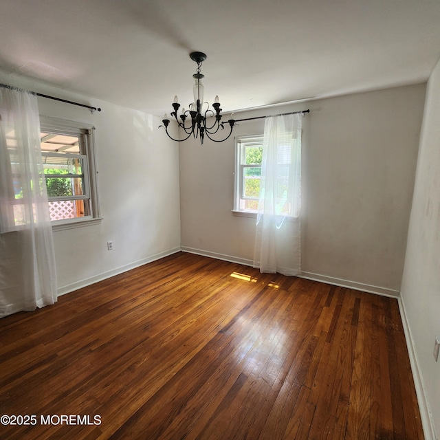 2102 Princeton Pike, Lawrence, NJ 08648 - empty room with a chandelier, hardwood / wood-style flooring, and baseboards
