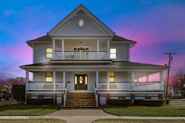 304 8th Ave, Belmar, NJ 07719 - greek revival inspired property with a balcony, a shingled roof, covered porch, and a front lawn