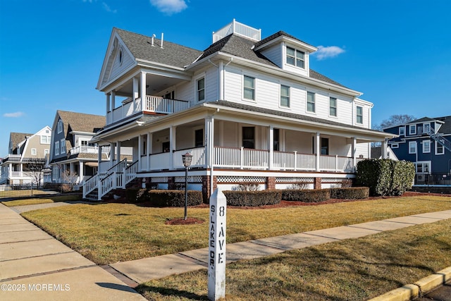 304 8th Ave, Belmar, NJ 07719 - view of front facade featuring a porch, a balcony, a front lawn, and a shingled roof