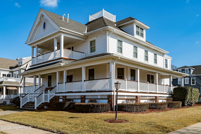 304 8th Ave, Belmar, NJ 07719 - view of front of property with a porch, a balcony, and a front yard