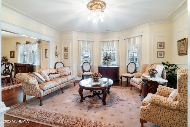 304 8th Ave, Belmar, NJ 07719 - living room featuring healthy amount of natural light, wood finished floors, ornamental molding, and a chandelier
