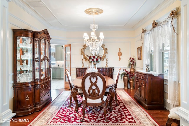 304 8th Ave, Belmar, NJ 07719 - dining area with a chandelier, dark wood-style floors, a decorative wall, and ornamental molding