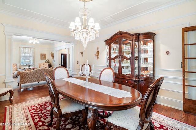 304 8th Ave, Belmar, NJ 07719 - dining area with a chandelier, crown molding, wood finished floors, a decorative wall, and decorative columns