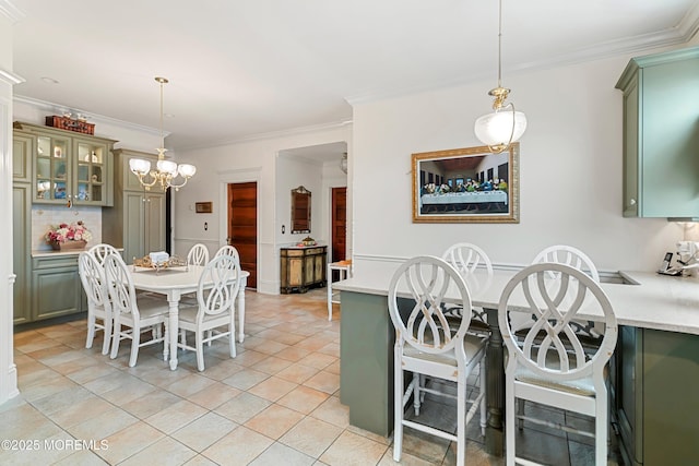 304 8th Ave, Belmar, NJ 07719 - dining area with ornamental molding, a chandelier, and light tile patterned floors