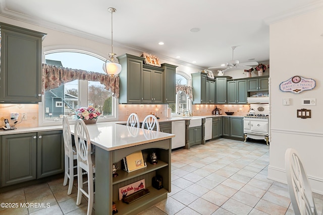 304 8th Ave, Belmar, NJ 07719 - kitchen with a ceiling fan, decorative backsplash, green cabinets, crown molding, and light countertops