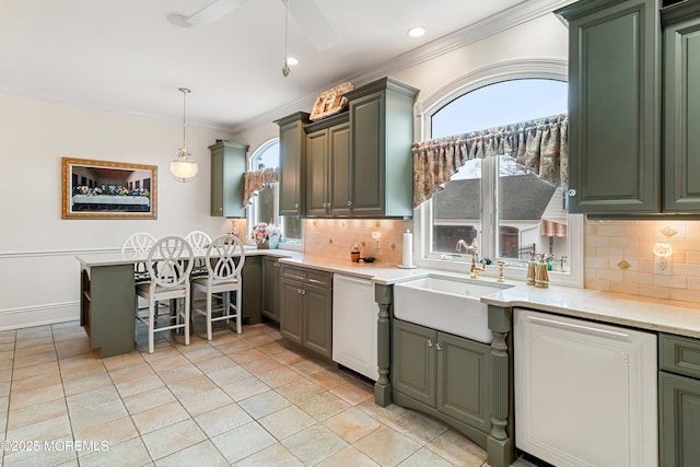 304 8th Ave, Belmar, NJ 07719 - kitchen with a sink, ornamental molding, dishwasher, light countertops, and decorative backsplash