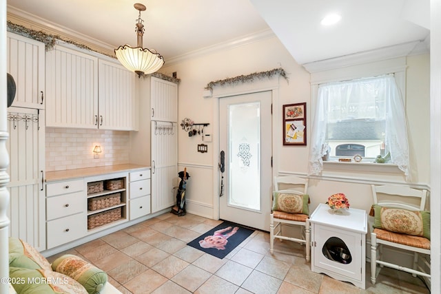 304 8th Ave, Belmar, NJ 07719 - kitchen with backsplash, light countertops, crown molding, decorative light fixtures, and light tile patterned floors