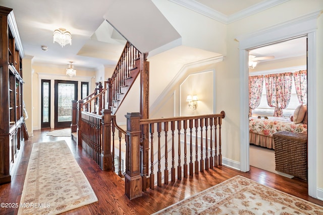 304 8th Ave, Belmar, NJ 07719 - entrance foyer with wood finished floors, baseboards, a chandelier, ornamental molding, and stairway