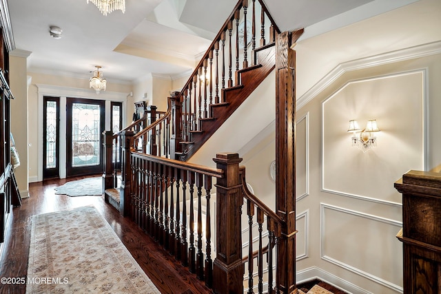 304 8th Ave, Belmar, NJ 07719 - foyer entrance featuring a chandelier, stairs, wood finished floors, and crown molding