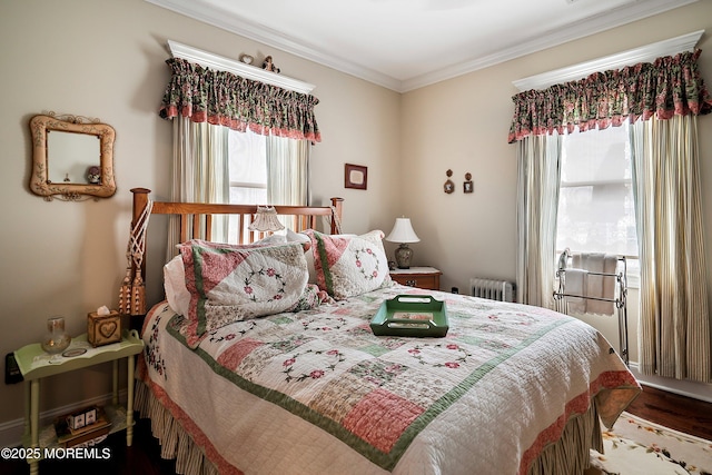 304 8th Ave, Belmar, NJ 07719 - bedroom with multiple windows, radiator, ornamental molding, and wood finished floors