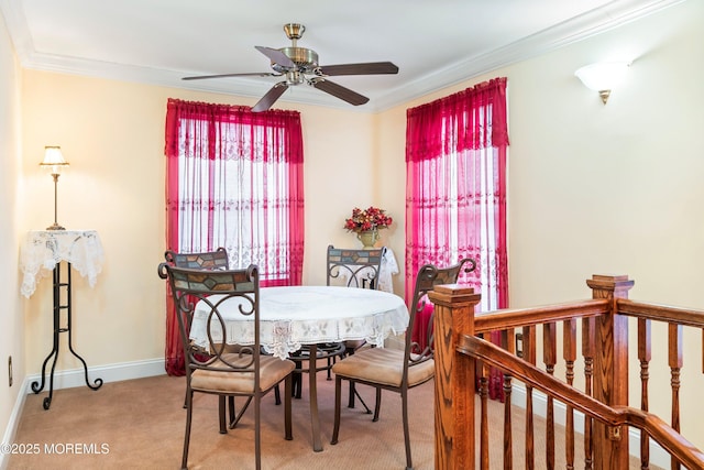 304 8th Ave, Belmar, NJ 07719 - dining area with light carpet, crown molding, ceiling fan, and baseboards