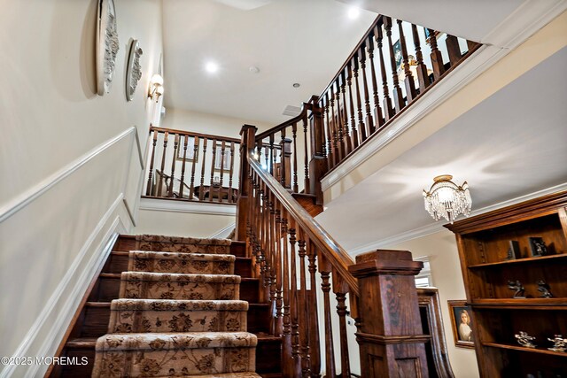304 8th Ave, Belmar, NJ 07719 - staircase with a chandelier, a towering ceiling, and ornamental molding