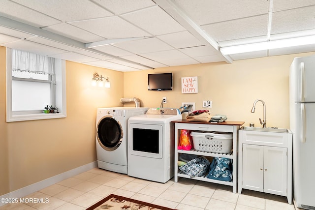 304 8th Ave, Belmar, NJ 07719 - laundry area with independent washer and dryer, light tile patterned floors, baseboards, and cabinet space