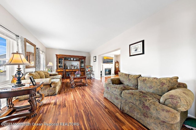 128 E Delaware Dr, Little Egg Harbor, NJ 08087 - living area featuring wood finished floors, a glass covered fireplace, and baseboards
