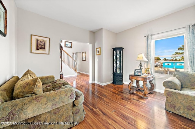 128 E Delaware Dr, Little Egg Harbor, NJ 08087 - living area with stairs, wood finished floors, and baseboards