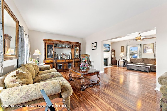 128 E Delaware Dr, Little Egg Harbor, NJ 08087 - living area with wood finished floors, a fireplace with flush hearth, and ceiling fan