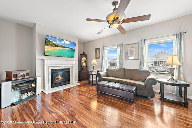 128 E Delaware Dr, Little Egg Harbor, NJ 08087 - living area with a premium fireplace, wood finished floors, and ceiling fan