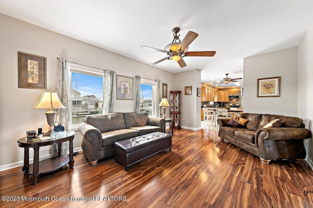 128 E Delaware Dr, Little Egg Harbor, NJ 08087 - living area with a ceiling fan, dark wood-type flooring, and baseboards