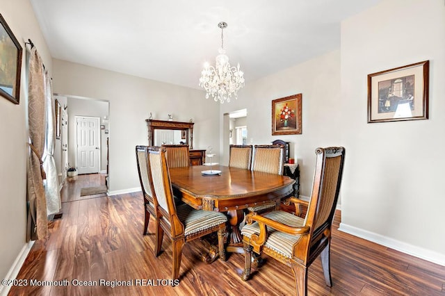 128 E Delaware Dr, Little Egg Harbor, NJ 08087 - dining room with wood finished floors, a chandelier, and baseboards