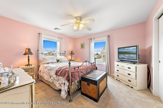 128 E Delaware Dr, Little Egg Harbor, NJ 08087 - bedroom featuring light carpet and a ceiling fan