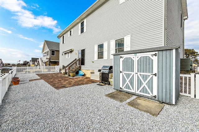 128 E Delaware Dr, Little Egg Harbor, NJ 08087 - back of house featuring a fenced backyard, entry steps, a patio area, and board and batten siding