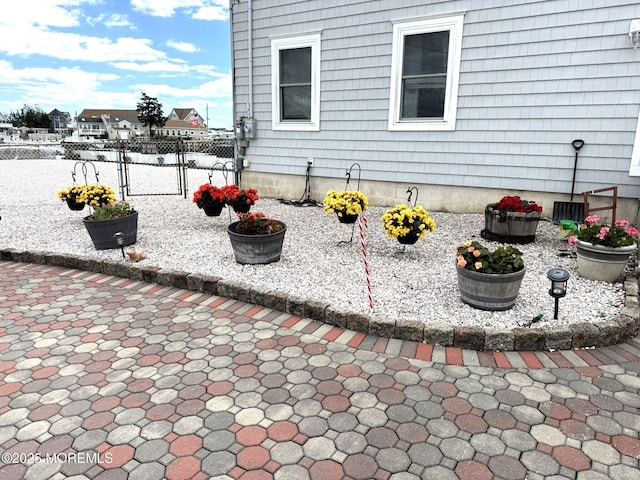 128 E Delaware Dr, Little Egg Harbor, NJ 08087 - view of side of property featuring a gate and a patio