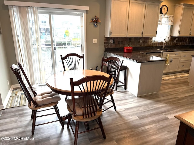 128 E Delaware Dr, Little Egg Harbor, NJ 08087 - dining area with light wood-type flooring and baseboards