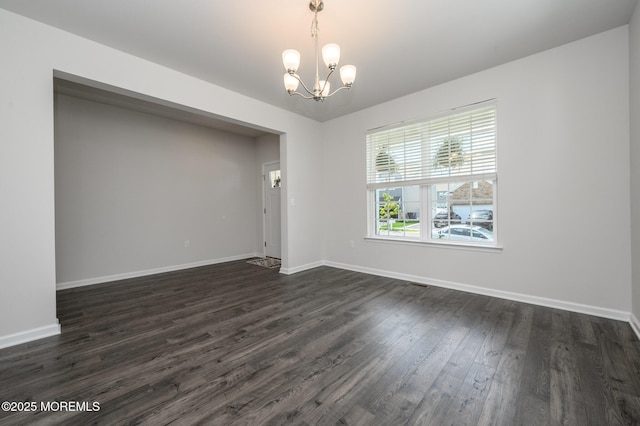 10 Osprey Ave, Manahawkin, NJ 08050 - empty room with a chandelier, dark wood-style flooring, and baseboards