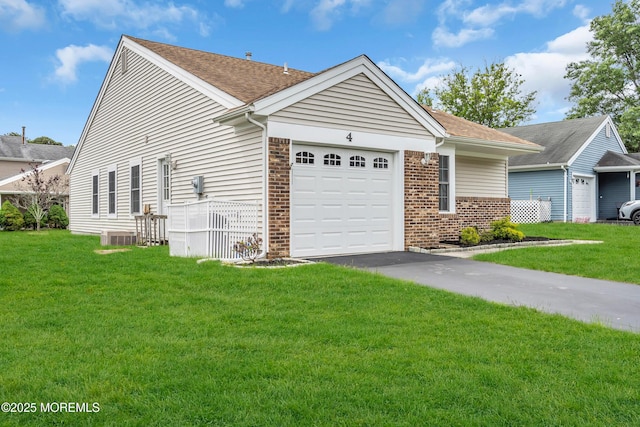 4 Beechwood Ct, Barnegat, NJ 08005 - view of front of home with brick siding, an attached garage, a front yard, and driveway