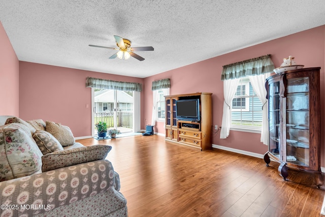 4 Beechwood Ct, Barnegat, NJ 08005 - living room with ceiling fan, a textured ceiling, wood finished floors, and baseboards