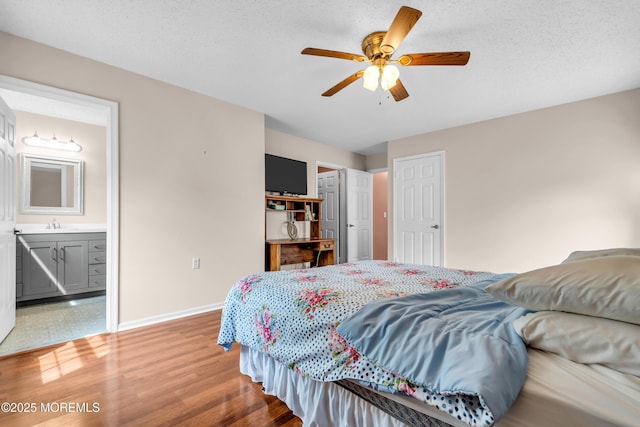 4 Beechwood Ct, Barnegat, NJ 08005 - bedroom with wood finished floors, baseboards, ensuite bath, and a ceiling fan