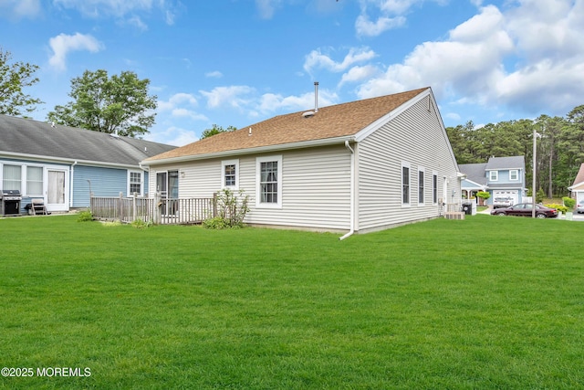 4 Beechwood Ct, Barnegat, NJ 08005 - rear view of property featuring a lawn, a wooden deck, and a shingled roof