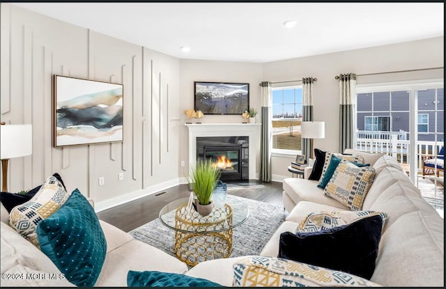 2707 Journey Ave, Marlboro, NJ 07746 - living room with wood finished floors, a glass covered fireplace, baseboards, and recessed lighting