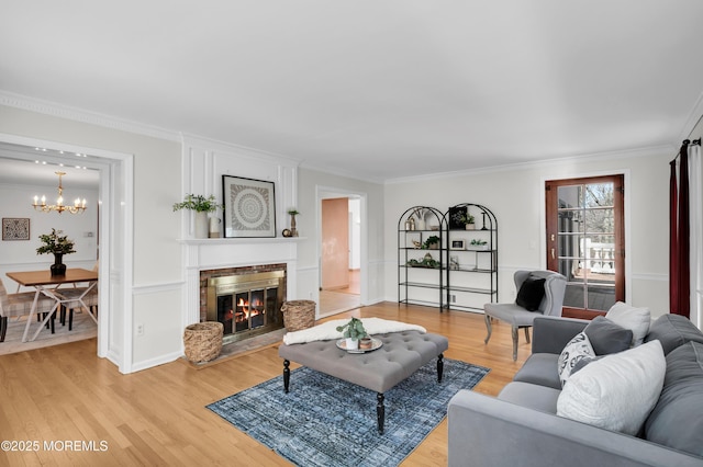 160 Pelican Rd, Middletown, NJ 07748 - living area with a chandelier, light wood-type flooring, crown molding, and a brick fireplace