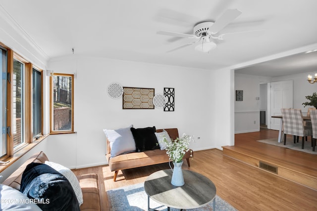 160 Pelican Rd, Middletown, NJ 07748 - living area featuring wood finished floors, a chandelier, baseboards, and a ceiling fan