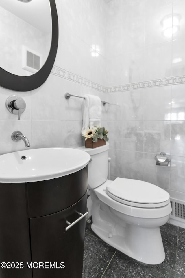 160 Pelican Rd, Middletown, NJ 07748 - bathroom featuring tile walls, toilet, and vanity