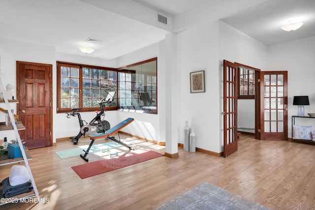 160 Pelican Rd, Middletown, NJ 07748 - workout room featuring wood finished floors, french doors, and baseboards