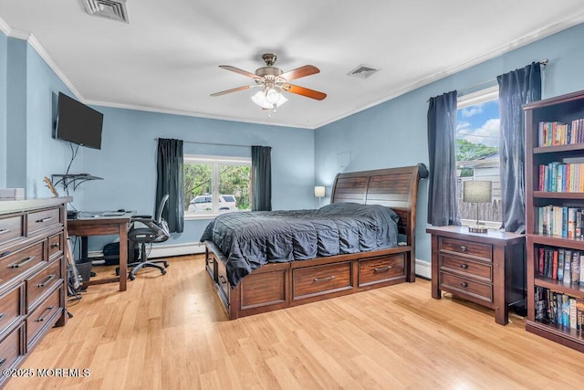 22 Franklin Ave, Hazlet, NJ 07734 - bedroom with light wood-style floors, a desk, crown molding, a ceiling fan, and a baseboard heating unit