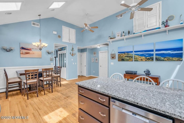 22 Franklin Ave, Hazlet, NJ 07734 - kitchen with stainless steel dishwasher, a skylight, ceiling fan, high vaulted ceiling, and light wood-style flooring