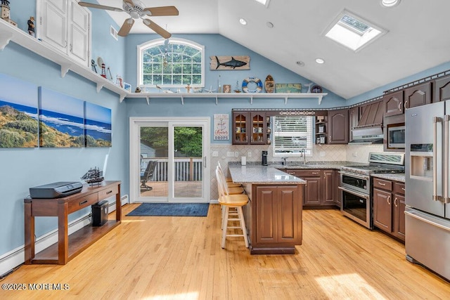 22 Franklin Ave, Hazlet, NJ 07734 - kitchen with stainless steel appliances, high vaulted ceiling, open shelves, a peninsula, and a breakfast bar