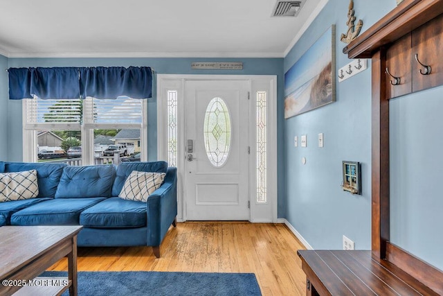 22 Franklin Ave, Hazlet, NJ 07734 - entrance foyer with light wood finished floors, ornamental molding, and baseboards