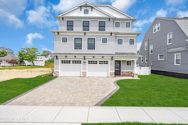 303 Forman Ave, Point Pleasant Beach, NJ 08742 - view of front of home featuring an attached garage, decorative driveway, a front yard, and stone siding